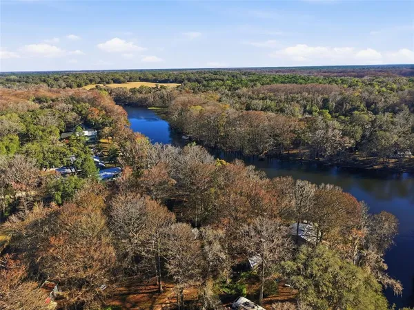 a view of a lake with a yard