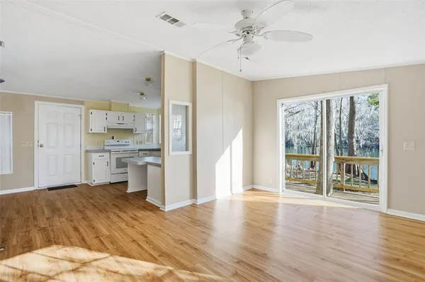 a view of a kitchen with wooden floor