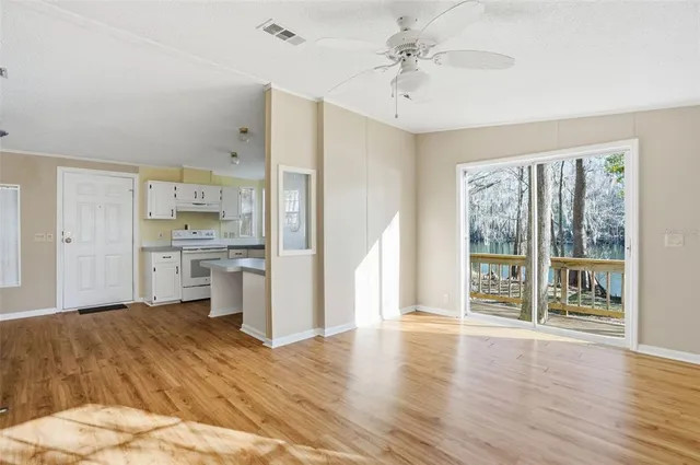 a view of a kitchen with wooden floor