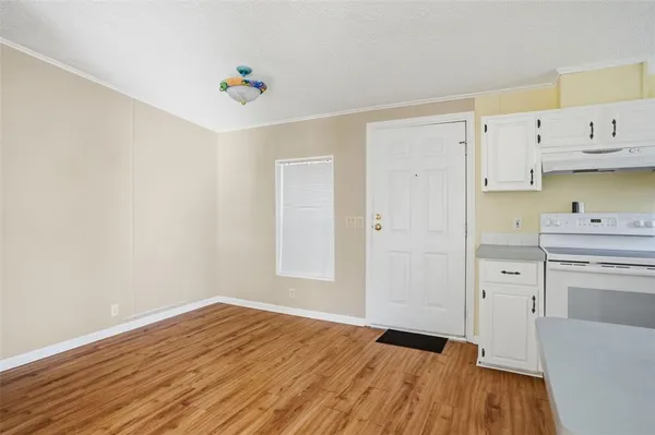 a view of kitchen with wooden floor