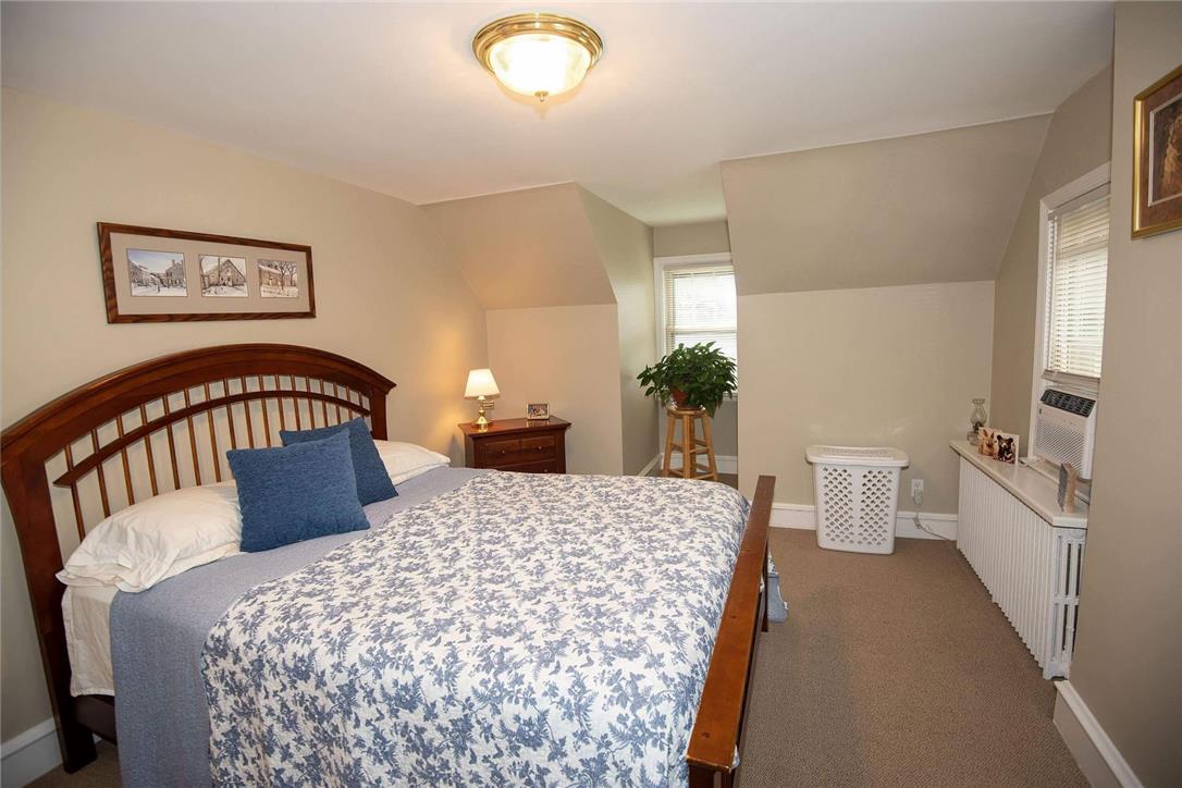 706 Stones Crossing Road Easton, PA 18045 - Photo 18 of 40 A restful bedroom offers sloped ceilings and ample natural light from multiple windows. A perfect Primary bedroom!