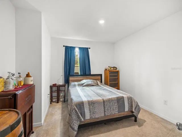 a view of walk in closet with clothes