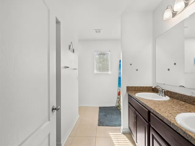 a white toilet sitting next to a bathroom sink