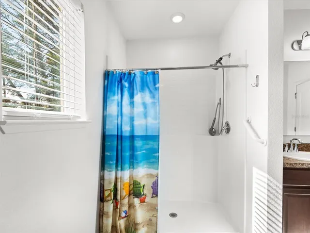 a bedroom with furniture and a window