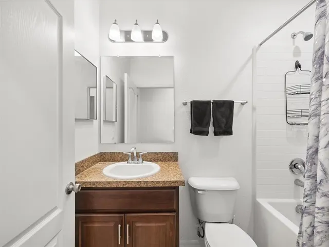 a view of a workspace with furniture and a couch