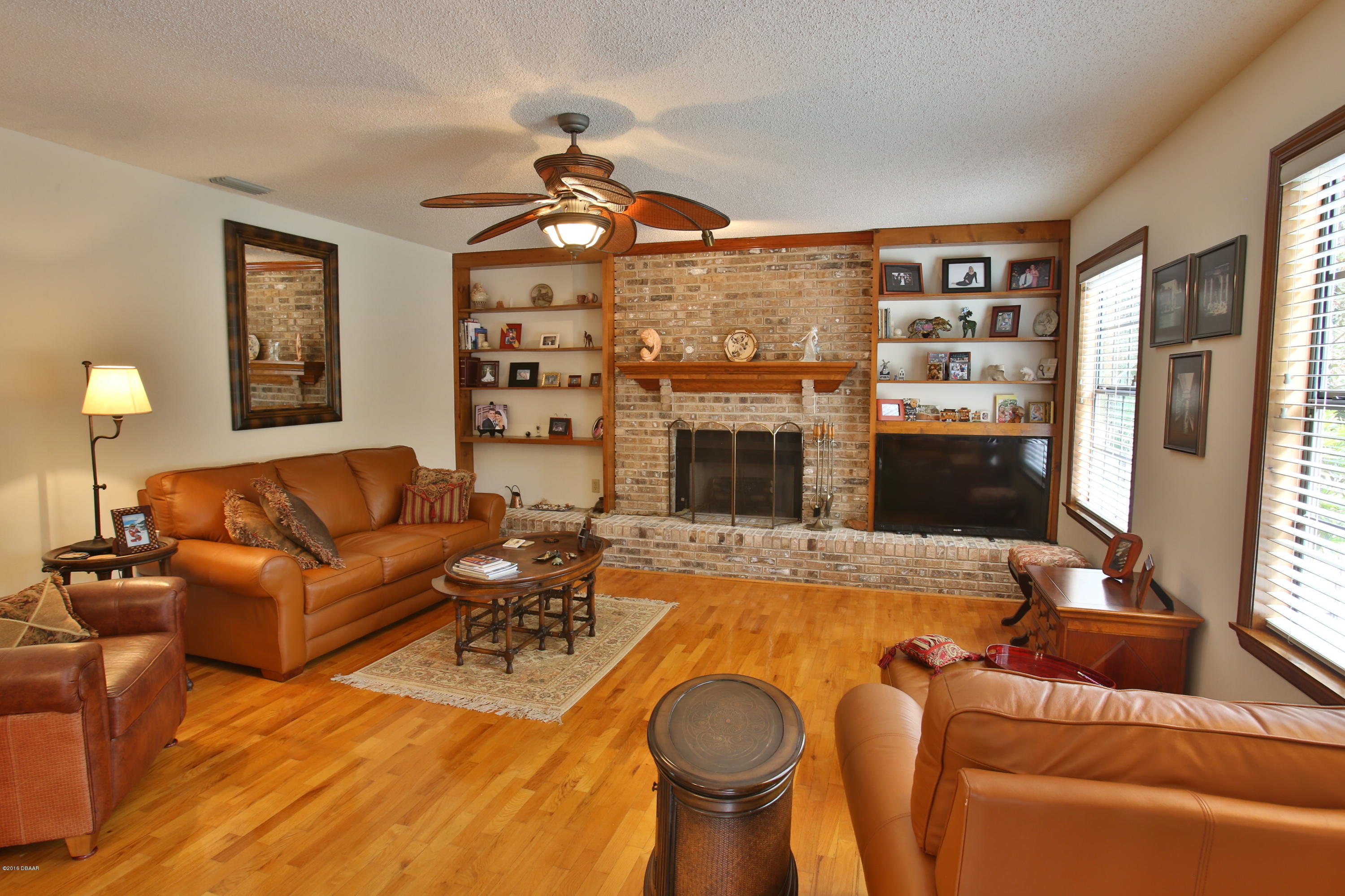657 Needlerush Road Port Orange, FL 32127 - Photo 5 of 29 Wall to Wall Hearth Brick Coziness