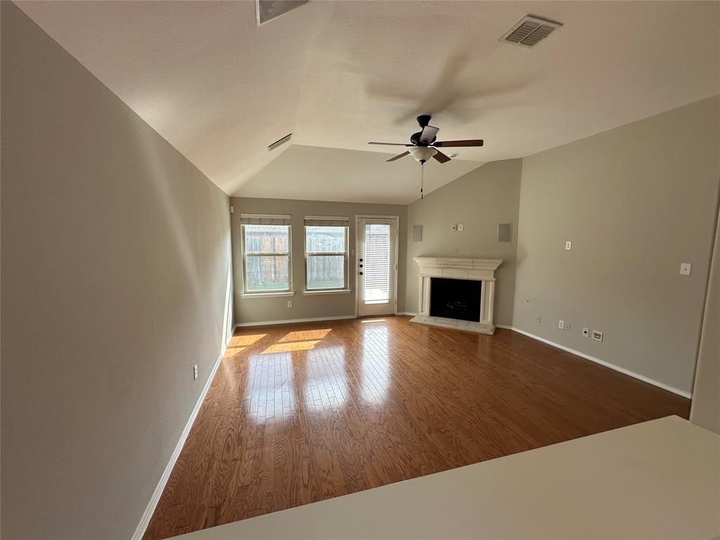 9321 Fenway Drive McKinney, TX 75072 - Photo 13 of 22 wooden floor in an empty room with a window