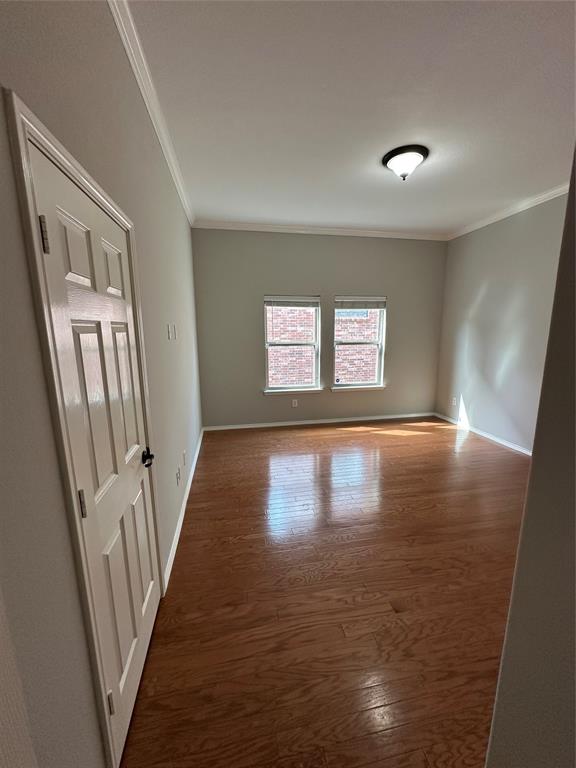 9321 Fenway Drive McKinney, TX 75072 - Photo 19 of 22 a view of a hallway with wooden floor and staircase