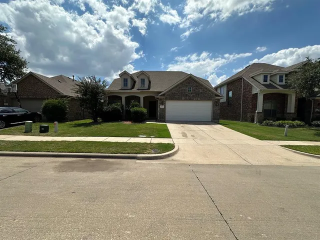 a view of house with yard and entertaining space