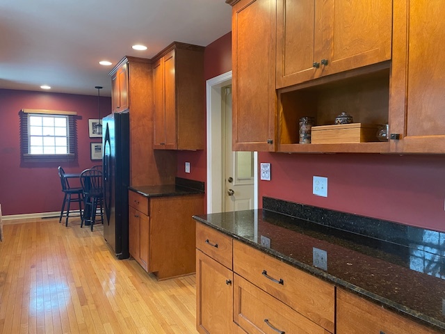 1505 West Acres Road Joliet, IL 60435 - Photo 13 of 42 a kitchen with stainless steel appliances granite countertop a stove a sink and a microwave