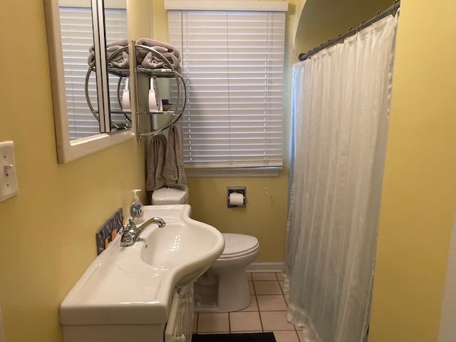 1505 West Acres Road Joliet, IL 60435 - Photo 22 of 42 a bathroom with a sink and a mirror
