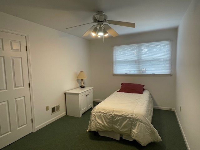 1505 West Acres Road Joliet, IL 60435 - Photo 26 of 42 a bedroom with a bed and a chandelier