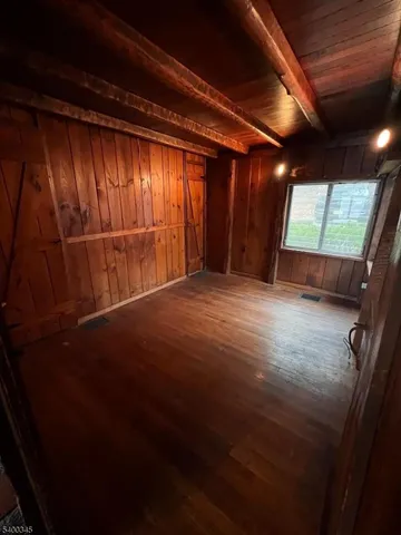 a bathroom with a sink a toilet a mirror and shower