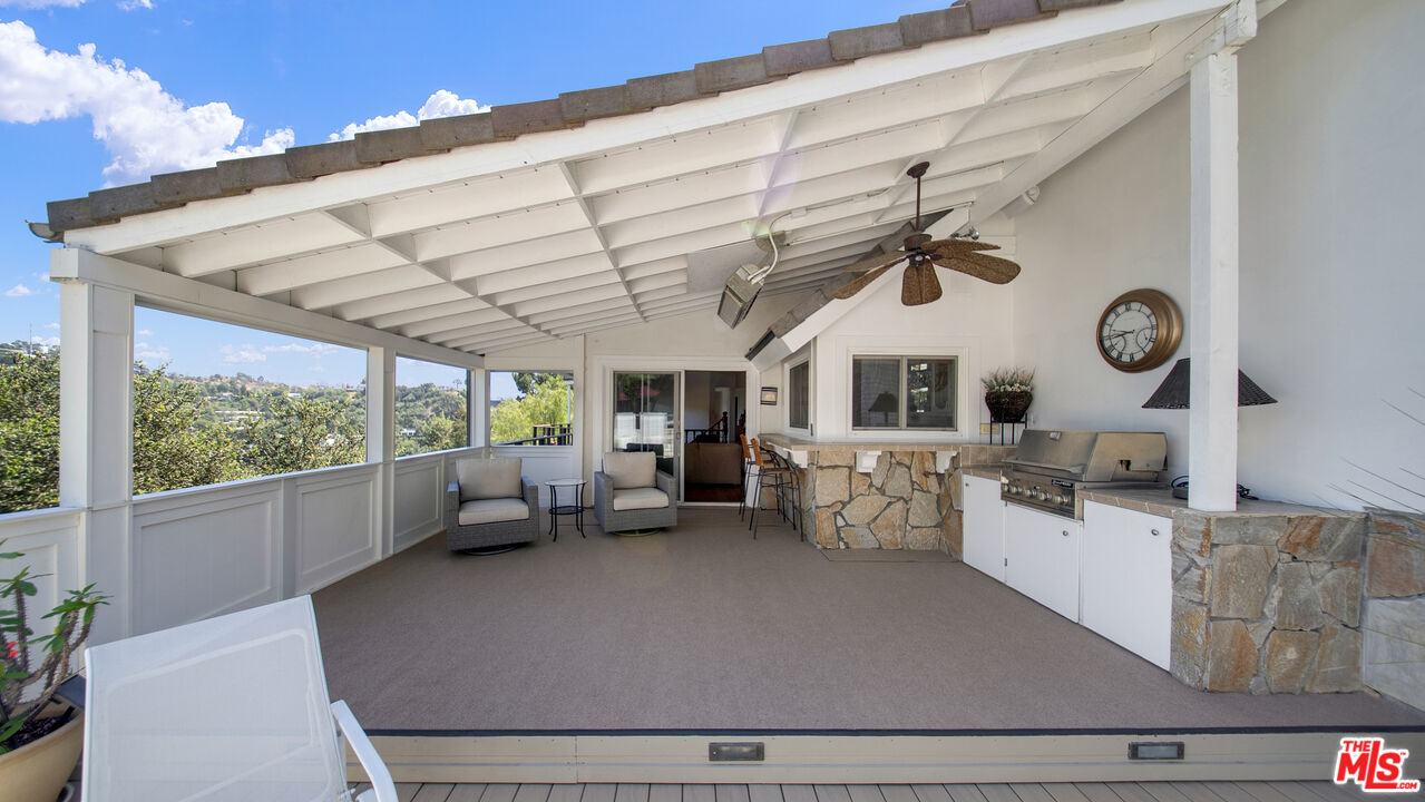 2312 Kimridge Road Beverly Hills, CA 90210 - Photo 19 of 60 a living room with furniture and a large window