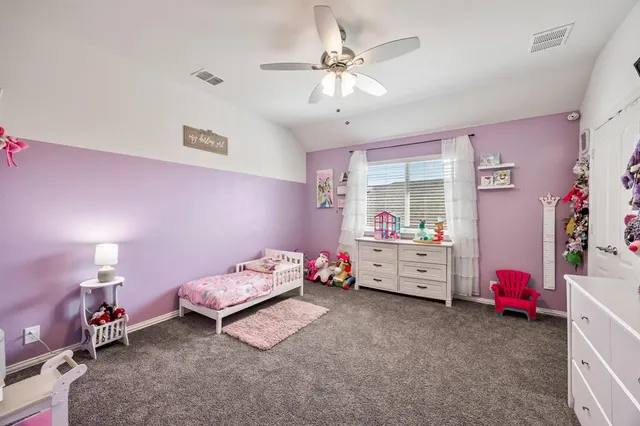 a bathroom with a double vanity sink mirror and shower