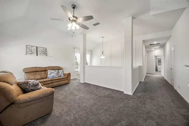 a view of washer and dryer with kitchen in the background