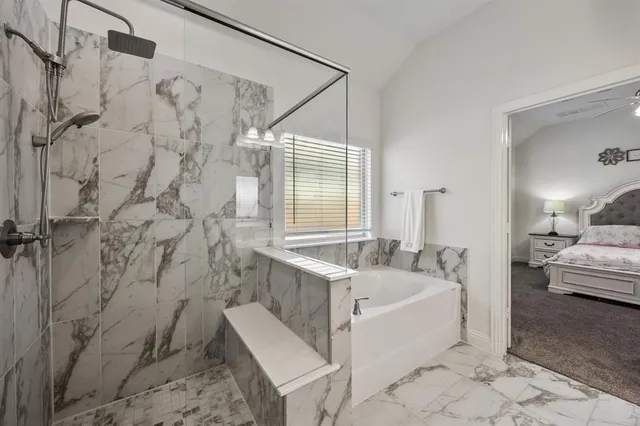 a spacious bathroom with a double vanity sink mirror and double