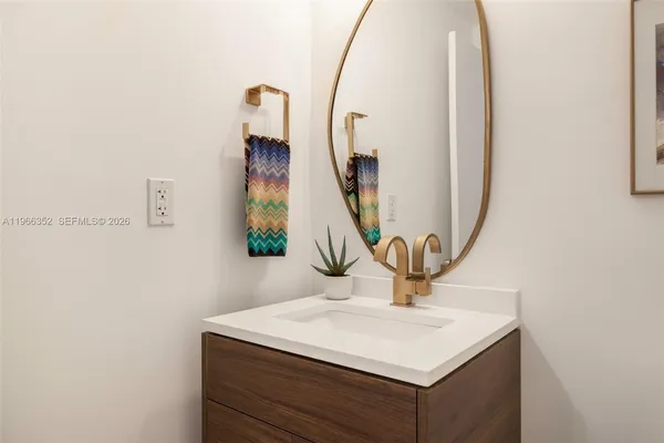 a sink with a mirror