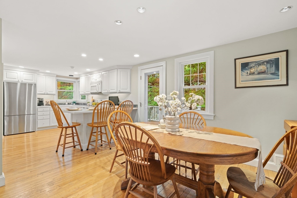 5 Brewster Road Arlington, MA 02478 - Photo 12 of 39 a dining room with furniture and wooden floor