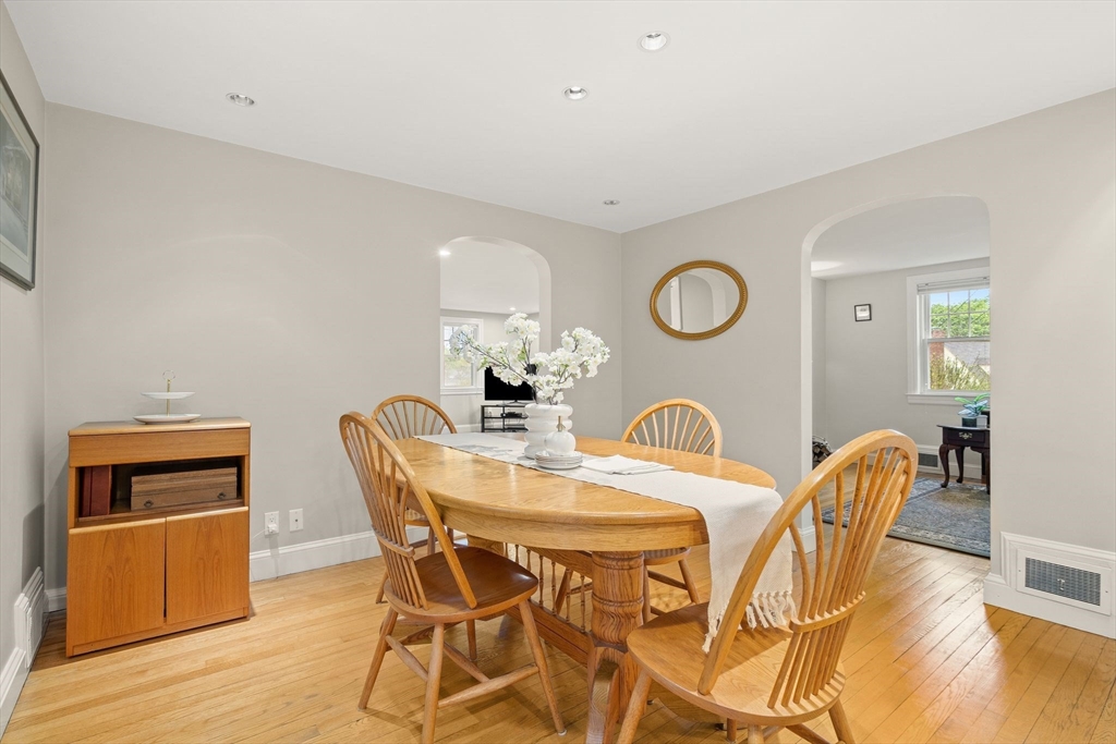 5 Brewster Road Arlington, MA 02478 - Photo 14 of 39 a view of a dining room with furniture and wooden floor