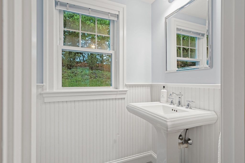 5 Brewster Road Arlington, MA 02478 - Photo 15 of 39 a bathroom with a sink and a window