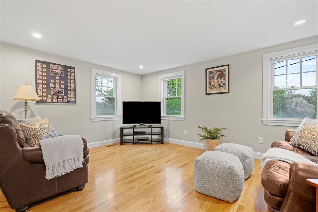 5 Brewster Road Arlington, MA 02478 - Photo 16 of 39 a living room with furniture and a flat screen tv