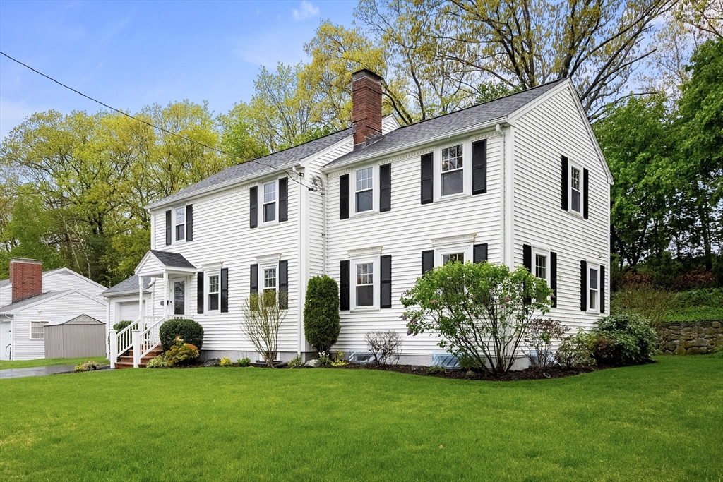 5 Brewster Road Arlington, MA 02478 - Photo 2 of 39 a front view of a house with a garden