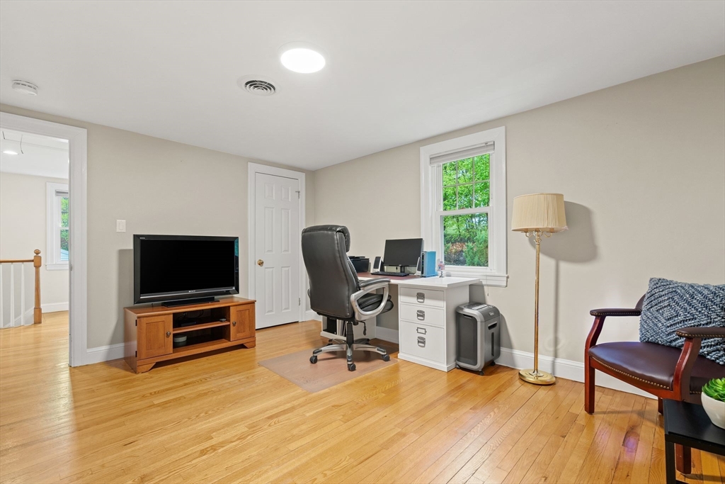 5 Brewster Road Arlington, MA 02478 - Photo 22 of 39 a view of a workspace with furniture and a window