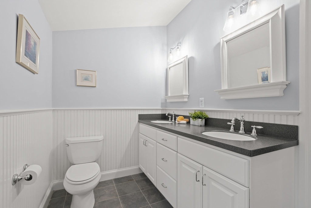 5 Brewster Road Arlington, MA 02478 - Photo 26 of 39 a bathroom with a toilet sink and mirror
