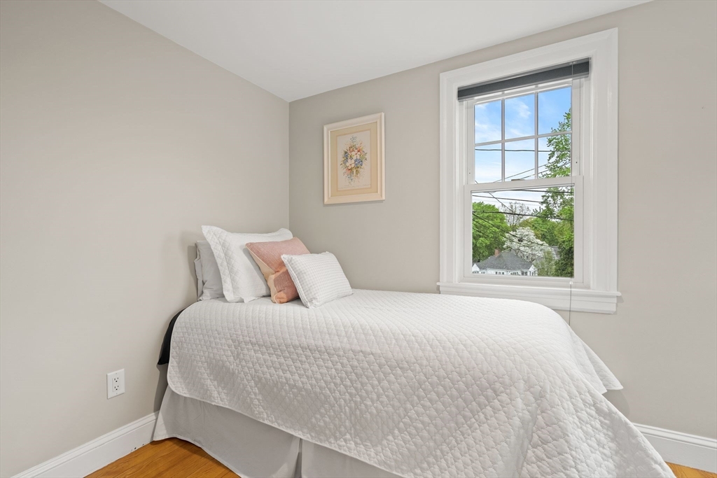 5 Brewster Road Arlington, MA 02478 - Photo 28 of 39 a bedroom with a bed and a window
