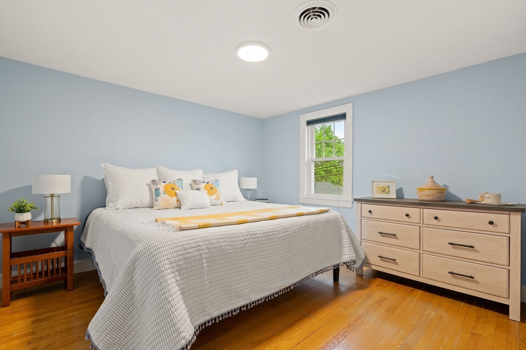 5 Brewster Road Arlington, MA 02478 - Photo 29 of 39 a bedroom with a bed and a dresser