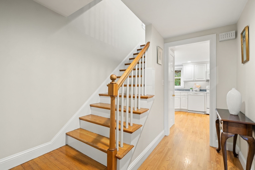 5 Brewster Road Arlington, MA 02478 - Photo 3 of 39 a view of a room with wooden floor and staircase