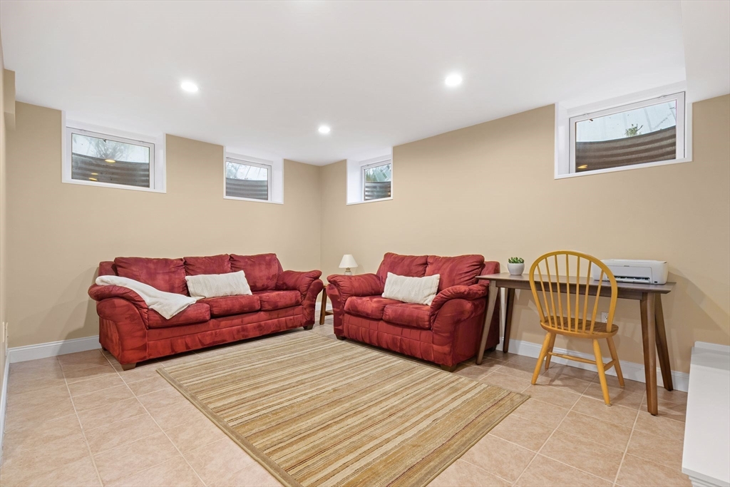 5 Brewster Road Arlington, MA 02478 - Photo 33 of 39 a living room with furniture and a wooden floor