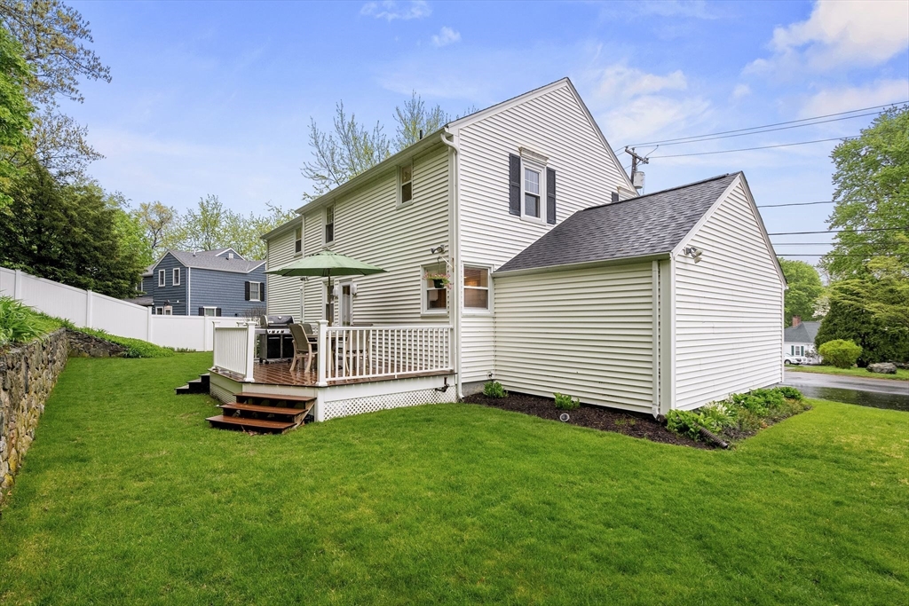 5 Brewster Road Arlington, MA 02478 - Photo 36 of 39 a white house with a small yard and large trees
