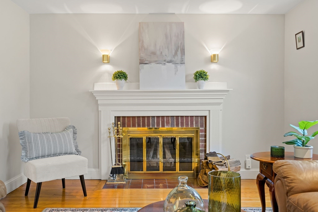 5 Brewster Road Arlington, MA 02478 - Photo 7 of 39 a living room with furniture and a fireplace