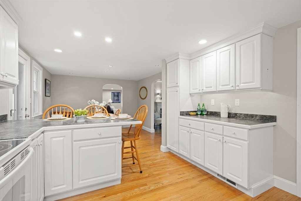 5 Brewster Road Arlington, MA 02478 - Photo 10 of 39 a kitchen with stainless steel appliances granite countertop a sink and cabinets