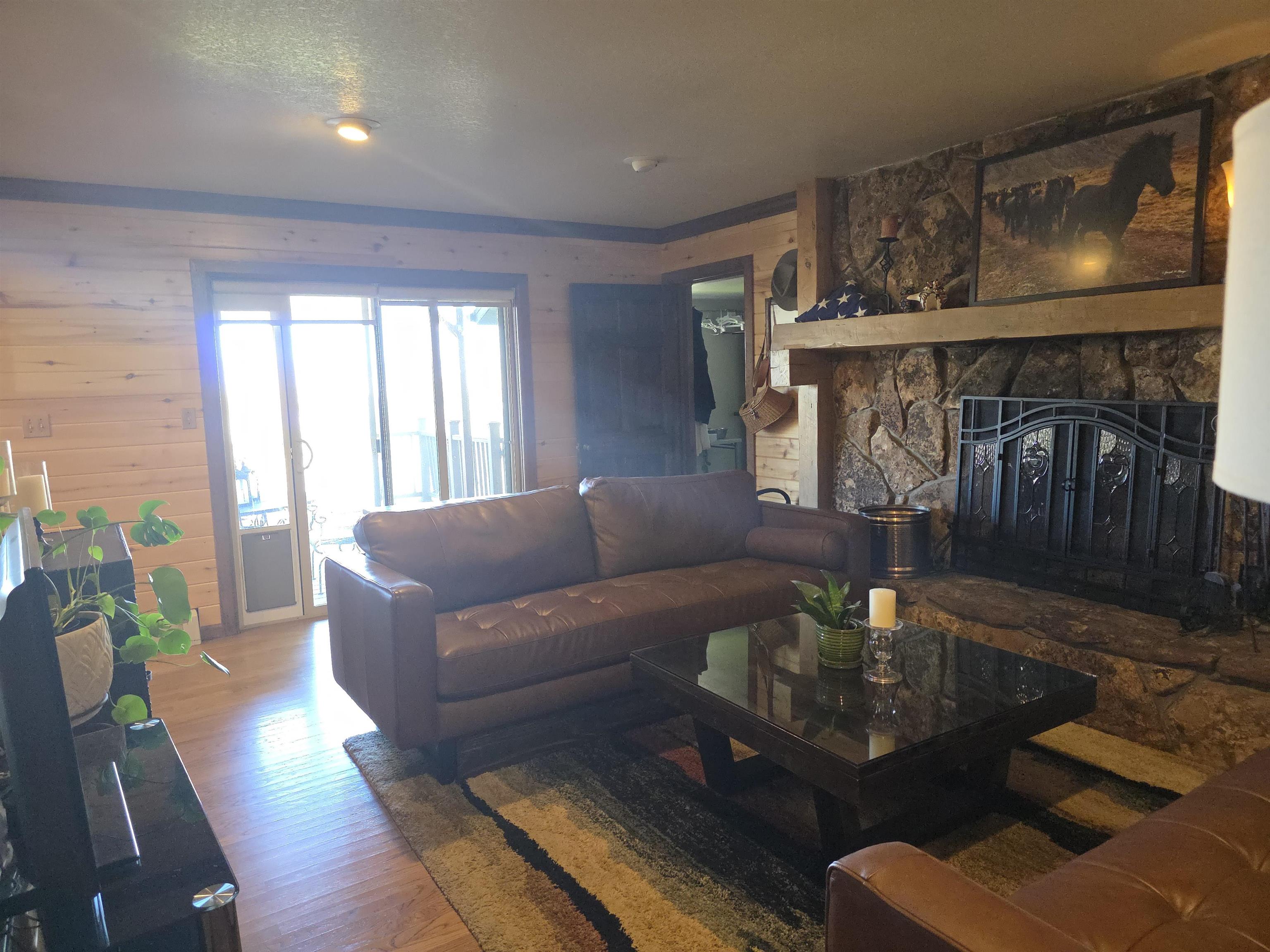 239 West Fallen Rock Road Grand Junction, CO 81507 - Photo 13 of 41 a living room with furniture and a fireplace