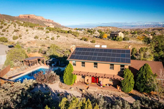 a backyard of a house with a yard and garage