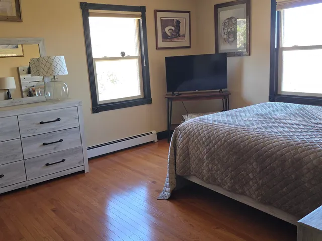 a living room with furniture with wooden floor