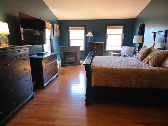 a view of walk in closet with clothes