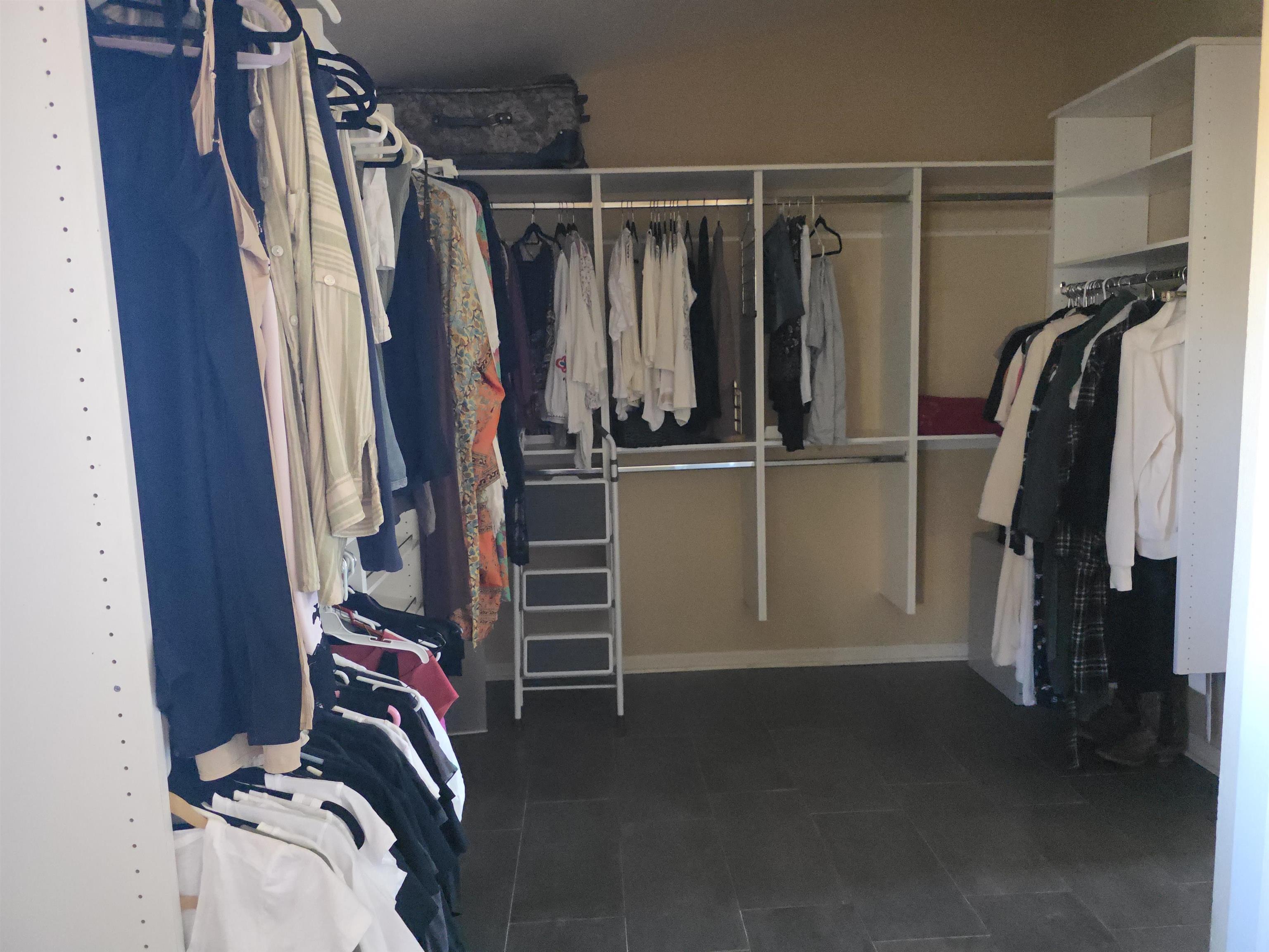 239 West Fallen Rock Road Grand Junction, CO 81507 - Photo 26 of 41 a view of walk in closet with clothes