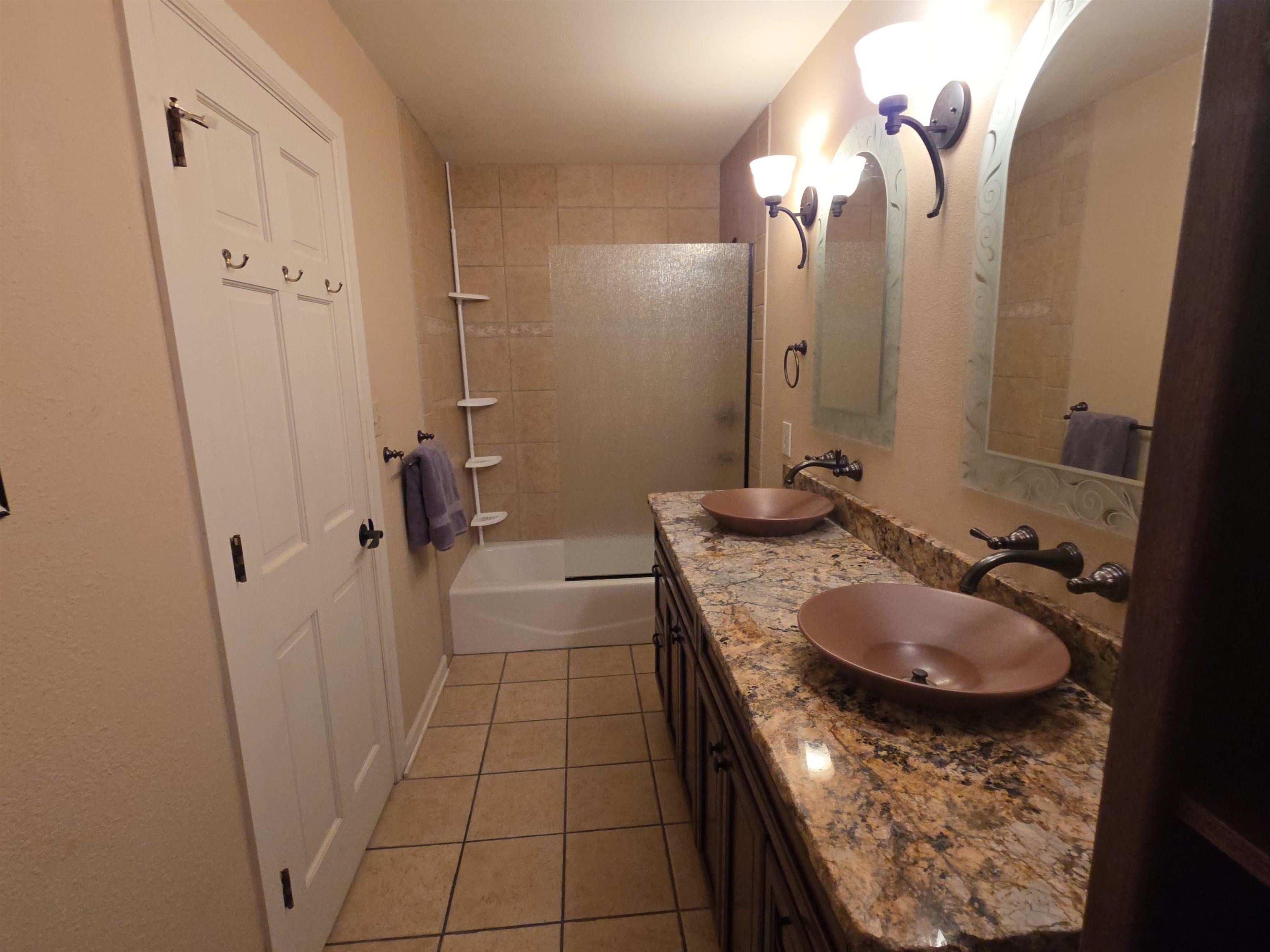 239 West Fallen Rock Road Grand Junction, CO 81507 - Photo 27 of 41 a bathroom with a granite countertop sink a mirror and vanity