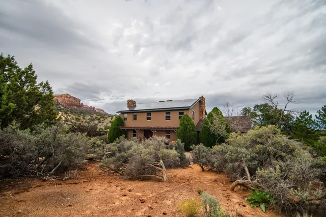 a view of a house with large windows