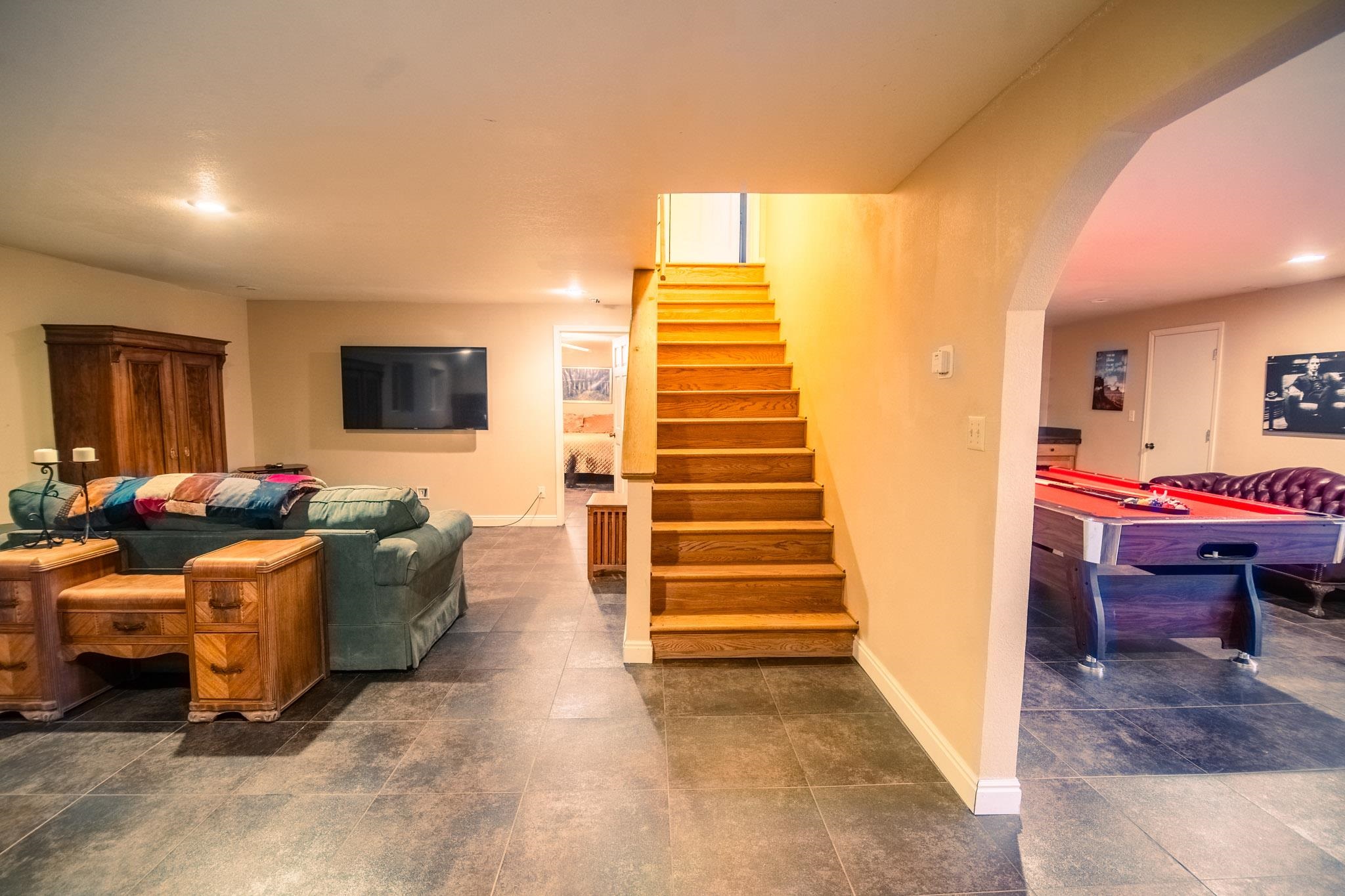 239 West Fallen Rock Road Grand Junction, CO 81507 - Photo 35 of 41 a living room with furniture and a flat screen tv