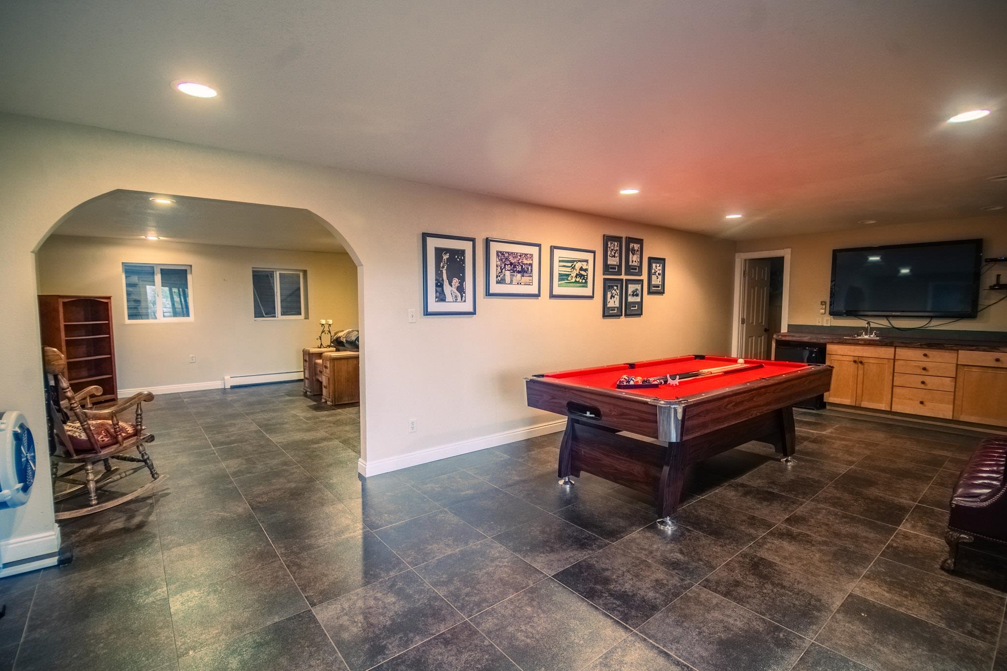 239 West Fallen Rock Road Grand Junction, CO 81507 - Photo 37 of 41 a room with pool table and flat screen tv