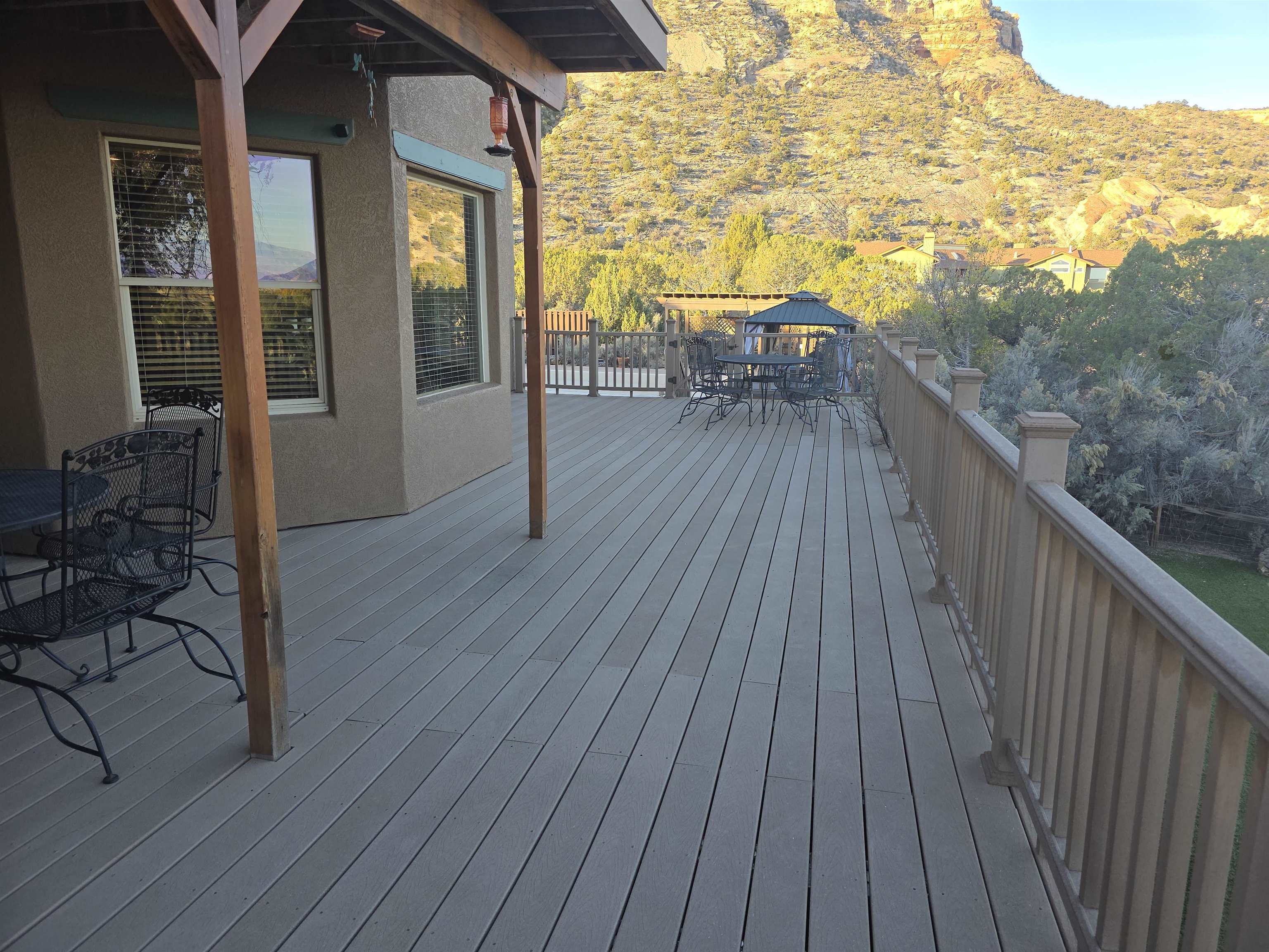 239 West Fallen Rock Road Grand Junction, CO 81507 - Photo 40 of 41 a balcony with wooden floor table and chairs