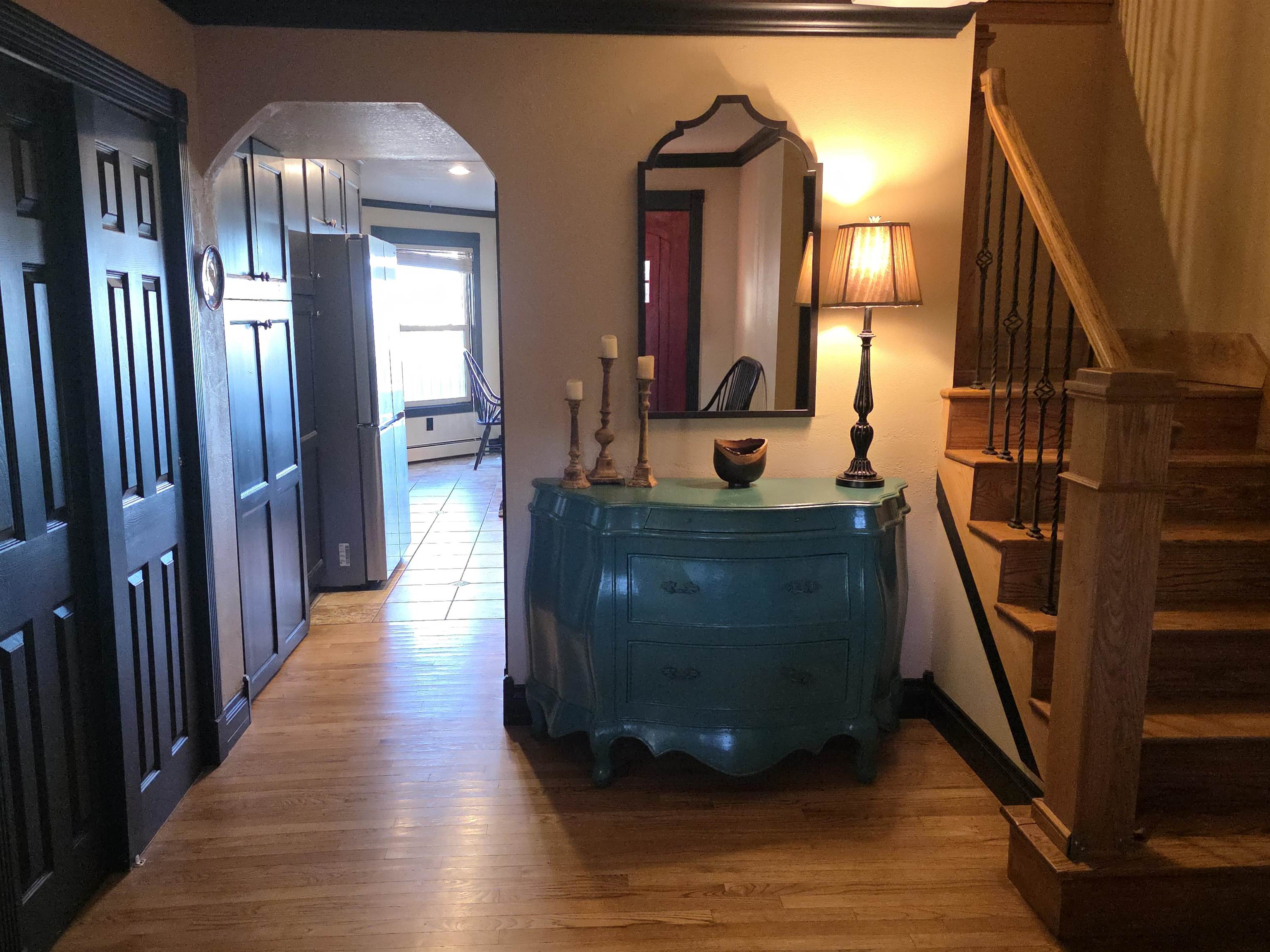 239 West Fallen Rock Road Grand Junction, CO 81507 - Photo 6 of 41 a view of a hallway with wooden floor and staircase