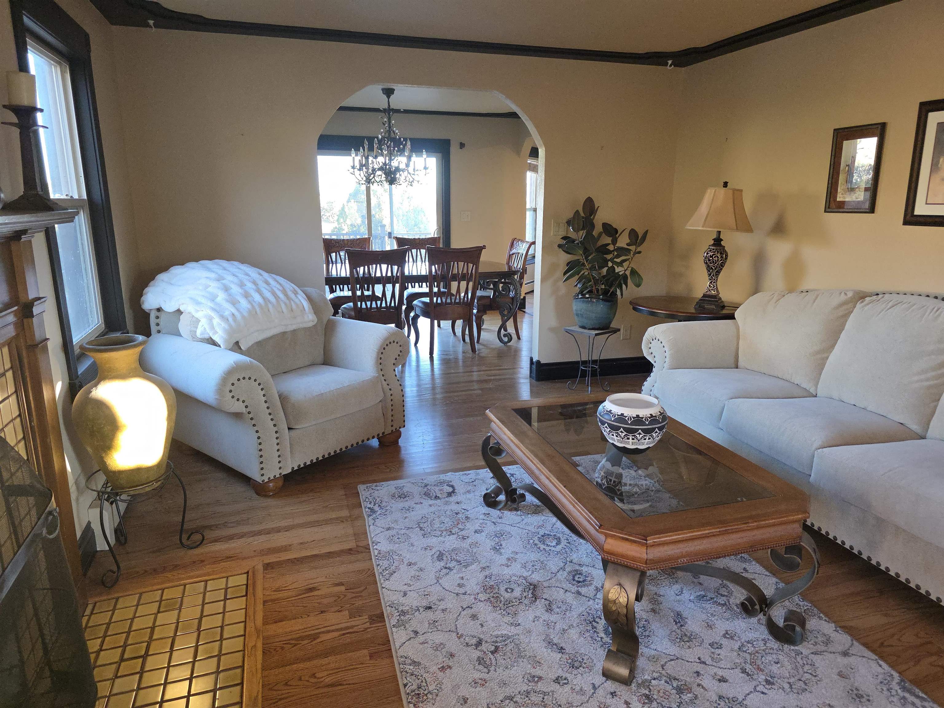 239 West Fallen Rock Road Grand Junction, CO 81507 - Photo 7 of 41 a living room with furniture and a chandelier