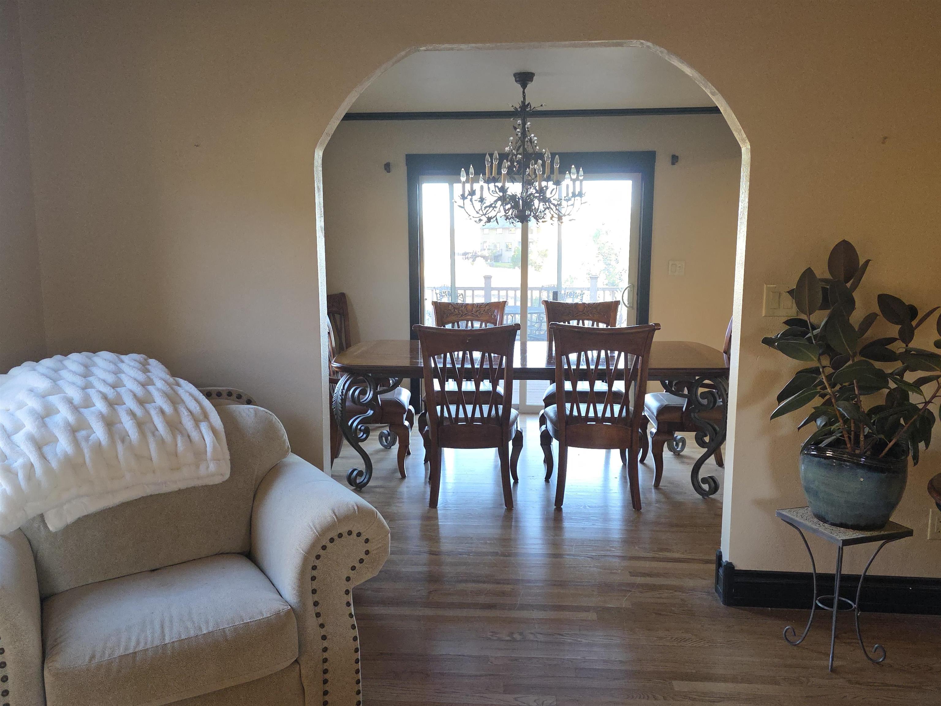 239 West Fallen Rock Road Grand Junction, CO 81507 - Photo 8 of 41 a living room with furniture and a chandelier