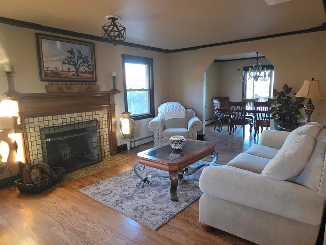 a view of a dining room with furniture window and wooden floor